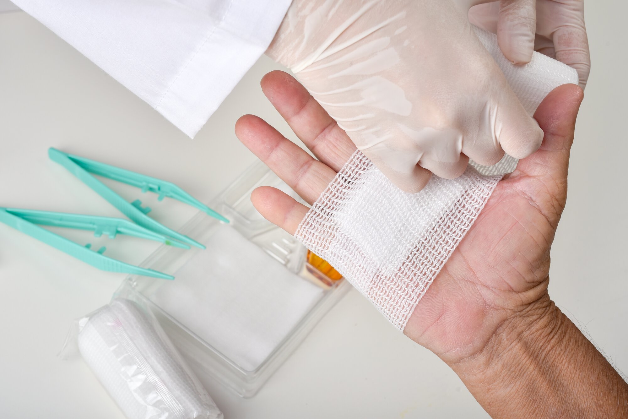 Doctor,Doing,Wound,Dressing,Care,And,Bandaging,Patient’s,Hand,,Hand